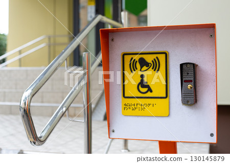 Accessible environment for people with disabilities. Assistance in climbing stairs in public place. Button to call staff for people in wheelchair. Care for incapacitated citizens Accessible environment for people with disabilities. Assistance in climbing stairs in public place. Button to call staff for people in wheelchair. Care for incapacitated citizens 130145879
