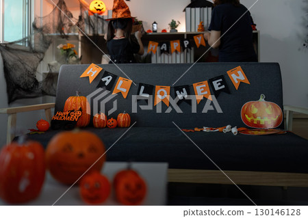 Halloween Decor. Festive indoor setting with pumpkins and decorations. Halloween Decor. Festive indoor setting with pumpkins and decorations. 130146128