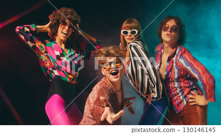 Glam retro group expressing charisma with colorful disco outfits 130146145