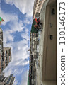 Aug 23 2025 Urban Residential Skyline Framed by Blue Skies and White Clouds 130146173