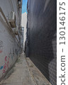Aug 23 2025 Narrow Alleyway Between Urban Buildings Featuring Graffiti 130146175