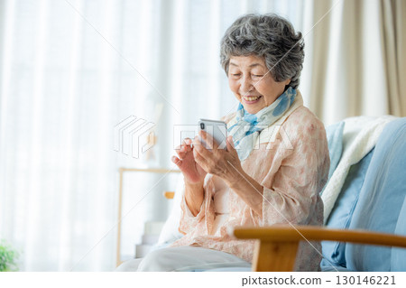 Senior woman using a smartphone 130146221