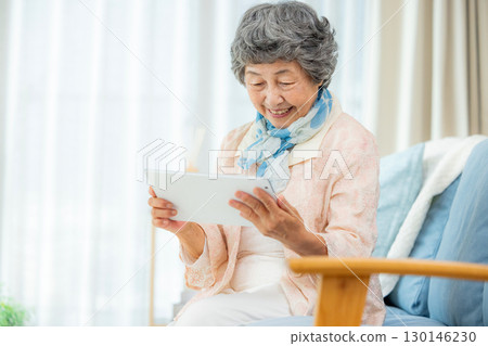 Senior women using tablet devices Senior women using tablet devices 130146230