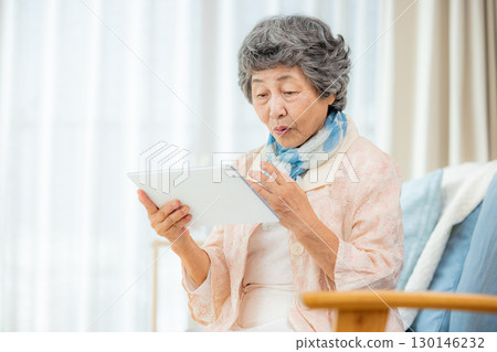 Senior women using tablet devices Senior women using tablet devices 130146232