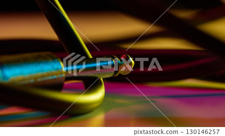 Audio jack connector on colorful background with neon glow Audio jack connector on colorful background with neon glow 130146257