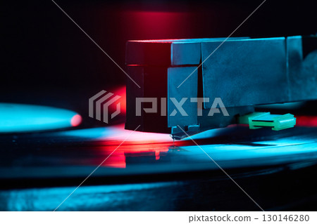 Vinyl record player stylus close up under neon lights Vinyl record player stylus close up under neon lights 130146280