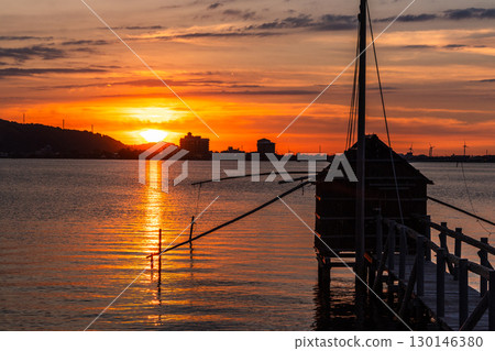 Evening view of Lake Togo: Sunset and a lookout hut for four-hand net fishing 130146380