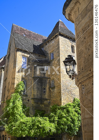 Exploring medieval architecture in Sarlat, Dordogne, reflecting the history and culture of Perigord 130146476