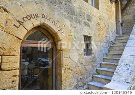 Exploring medieval architecture in Sarlat, Dordogne, reflecting the history and culture of Perigord 130146549