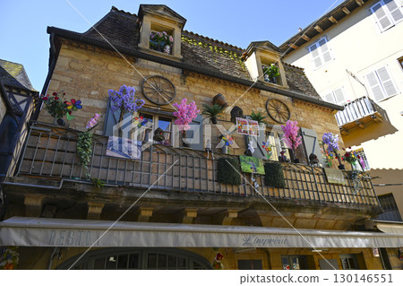 Exploring medieval architecture in Sarlat, Dordogne, reflecting the history and culture of Perigord 130146551