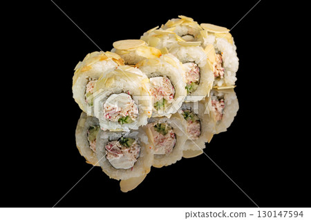 Delicious sushi rolls with crab, cucumber and cream cheese topped with almond flakes Delicious sushi rolls with crab, cucumber and cream cheese topped with almond flakes 130147594