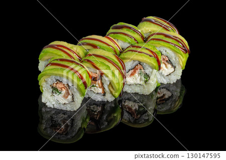 Fresh sushi rolls with salmon, cream cheese, cucumber and avocado topping with sauce Fresh sushi rolls with salmon, cream cheese, cucumber and avocado topping with sauce 130147595