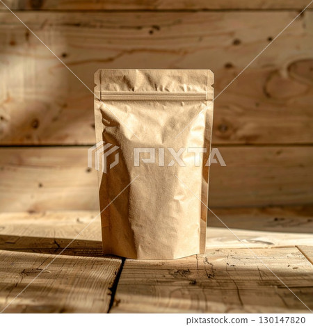 Studio Shot of a Brown Paper Stand Up Pouch on Wooden Background for Packaging Mockup 130147820