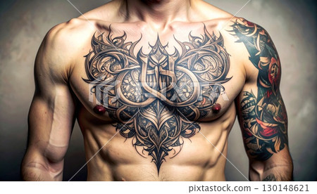 Detailed Black Ink Tattoo on Man Chest and Arm Muscles with Studio Lighting and Gray Backdrop 130148621