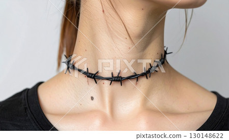 Close Up of Young Woman with Black Barbed Wire Choker in Studio with White Background 130148622