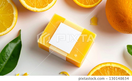 Orange Soap Bar Mockup with Citrus Slices and Green Leaves on White Background in Natural Light 130148634
