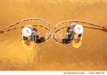 Close-up of advanced in-ear audio gear with black earphones 130148678