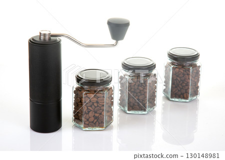 black manual coffee grinder for coffee beans and three glass transparent jars  130148981