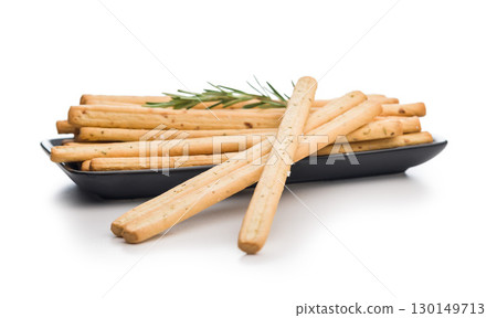 Crispy grissini breadsticks isolated on white background. 130149713