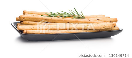Crispy grissini breadsticks isolated on white background. Crispy grissini breadsticks isolated on white background. 130149714