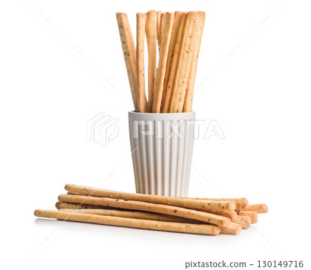 Crispy grissini breadsticks isolated on white background. 130149716