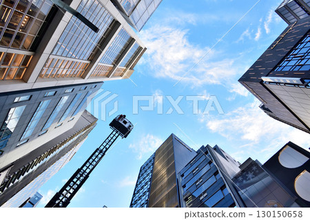 A ladder truck stretches high into the sky at an event on Ginza Street 130150658