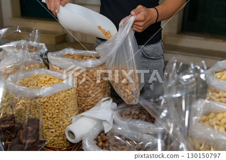 Shopping Almonds for Healthy Snacks at a Local Market 130150797