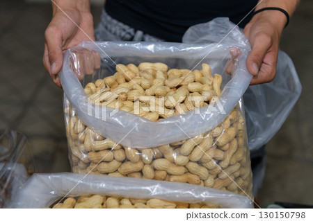 Vendor Sells Fresh Peanuts at a Local Market Vendor Sells Fresh Peanuts at a Local Market 130150798