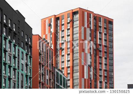 Modern high-rise apartment buildings in a bustling residential area showcasing urban living and Modern high-rise apartment buildings in a bustling residential area showcasing urban living and 130150825