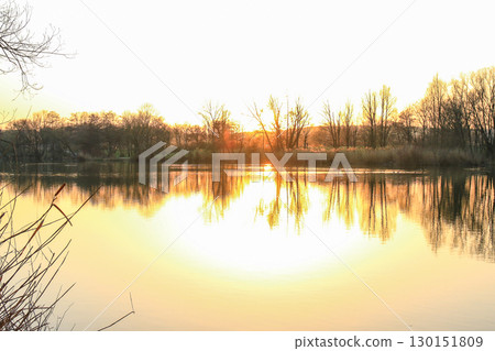 Peaceful Autumn Lake Surrounded By Vibrant Colorful Trees Peaceful Autumn Lake Surrounded By Vibrant Colorful Trees 130151809