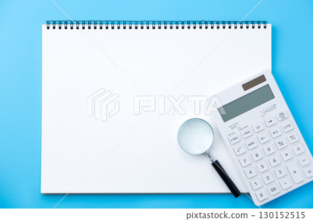 Sketchbook, magnifying glass and calculator Sketchbook, magnifying glass and calculator 130152515