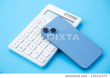 White calculator and smartphone 130152575