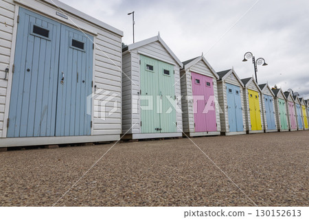 Pastel Beach Huts on the Seafront Promenade at Lyme Regis, Dorset, England Pastel Beach Huts on the Seafront Promenade at Lyme Regis, Dorset, England 130152613