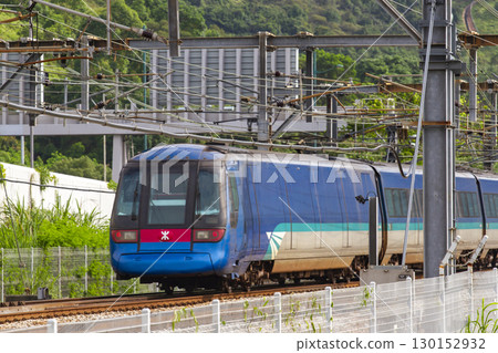 A Train Of Hong Kong MTR (Mass Transit Railway) Moving At Sunny Bay Area, Hong Kong. A Train Of Hong Kong MTR (Mass Transit Railway) Moving At Sunny Bay Area, Hong Kong. 130152932