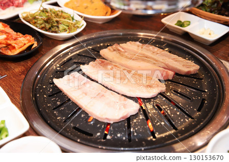 Korean BBQ. Charcoal grilled pork belly Korean BBQ. Charcoal grilled pork belly 130153670