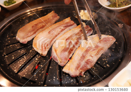 Korean BBQ. Charcoal grilled pork belly Korean BBQ. Charcoal grilled pork belly 130153680