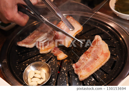 Korean BBQ. Charcoal grilled pork belly Korean BBQ. Charcoal grilled pork belly 130153694