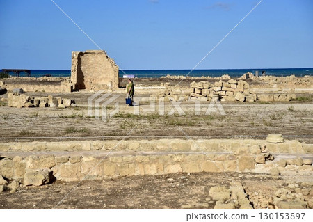 Ruins and the Mediterranean Sea, the contrast between ancient ruins and the blue sea, travelers walking through history, traces of coastal civilizations, and scenes of lost cities. 130153897