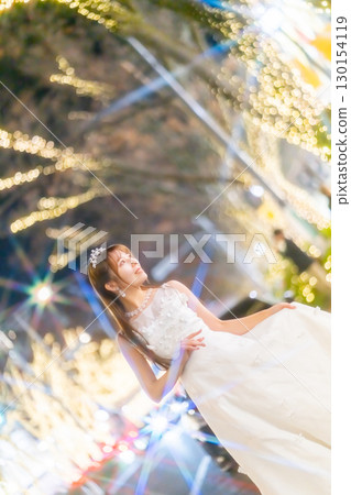 Christmas lights and a woman in a dress 130154119