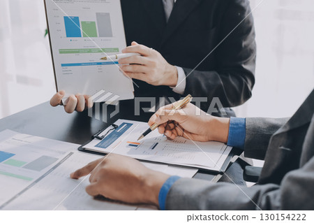 Accounting company provide finance and taxation planning for profitable cash flow, Auditor and accountant team working in office, analyze financial data and accounting record with calculator.Insight 130154222