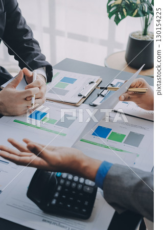 Accounting company provide finance and taxation planning for profitable cash flow, Auditor and accountant team working in office, analyze financial data and accounting record with calculator.Insight 130154225