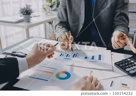 Accounting company provide finance and taxation planning for profitable cash flow, Auditor and accountant team working in office, analyze financial data and accounting record with calculator.Insight 130154232