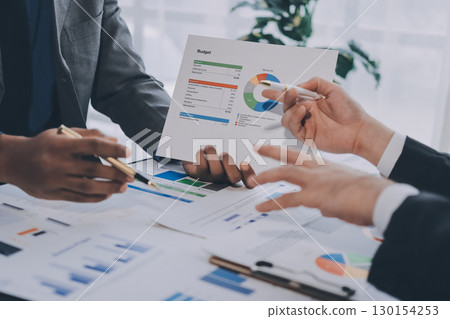 Accounting company provide finance and taxation planning for profitable cash flow, Auditor and accountant team working in office, analyze financial data and accounting record with calculator.Insight 130154253