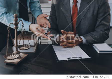 Lawyer explained to the client about the law that must be brought against the court case. 130154299