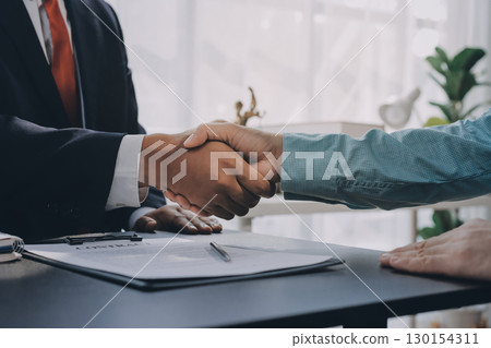 Lawyer explained to the client about the law that must be brought against the court case. Lawyer explained to the client about the law that must be brought against the court case. 130154311