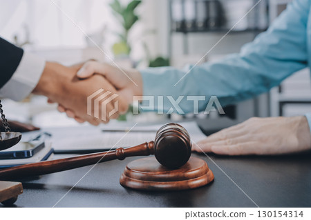 Lawyer explained to the client about the law that must be brought against the court case. Lawyer explained to the client about the law that must be brought against the court case. 130154314