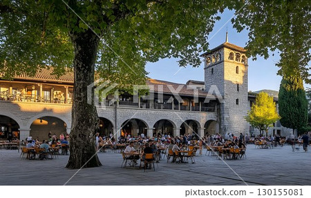 Evening Sunlight Illuminates Outdoor Dining in Historic European Evening Sunlight Illuminates Outdoor Dining in Historic European 130155081