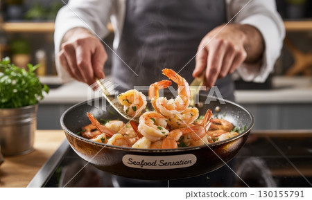 Chef hands stirring delicious golden shrimp with parsley in a hot pan on a stovetop Chef hands stirring delicious golden shrimp with parsley in a hot pan on a stovetop 130155791