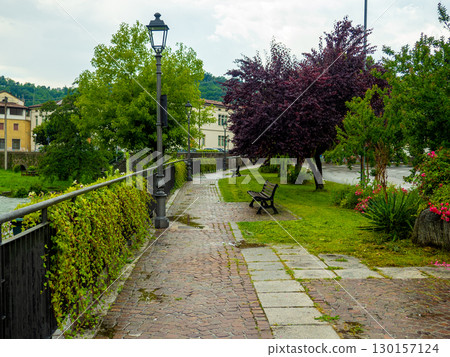 Cityscape with river and walkway in village of Sabbio Chiese, Brescia, Italy 130157124