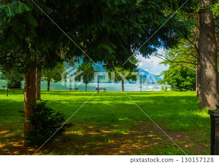 Crone public park with empty benches on Lake Idro, Lombardy, Italy. 130157128